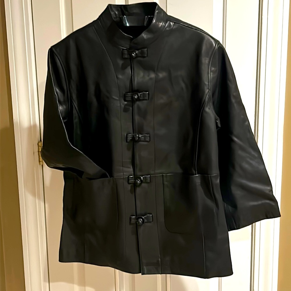 Men’s Medium 100% leather button down coat. Initial Unusual Experience brand.